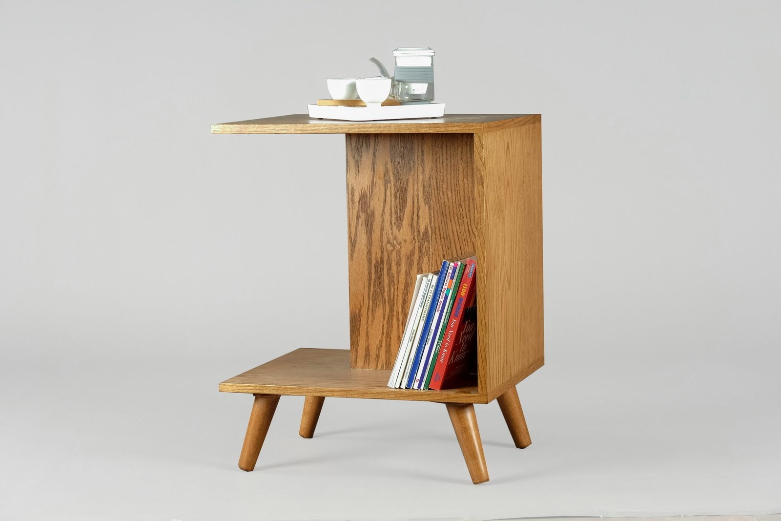 brown wooden table with books and mugs